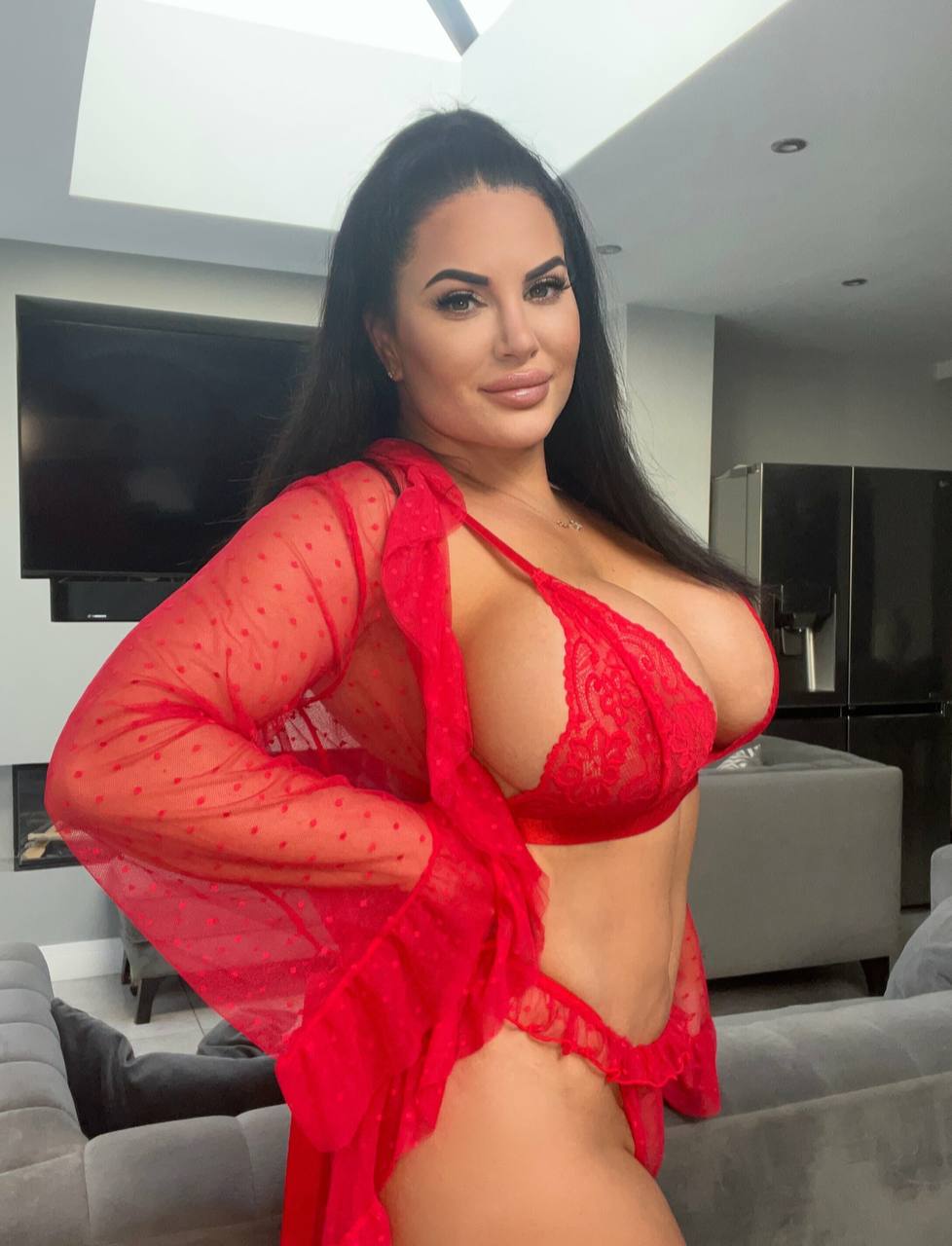 Evy Melaabrunettewoman posingsitting sensuallyprovocatively